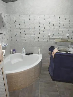 a bathroom with a bath tub in a room at Flat in villa San George in Hurghada