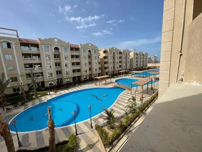 an image of a swimming pool in a resort at Aven Resort Compound in Hurghada