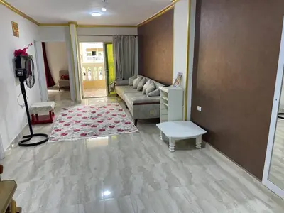 a living room with a couch and a table at Aven Resort Compound in Hurghada