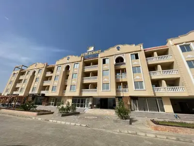 a large building with balconies on the side of it at Aven Resort Compound in Hurghada