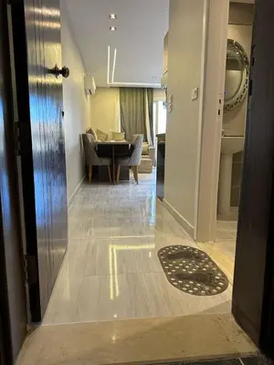 a hallway with a living room and a dining room at 2 Bedroom in Al Hambra - Mamsha in Hurghada