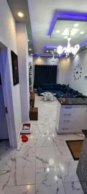 a living room with a marble floor and a blue ceiling at Turtles Beach Resort- Hurghada in Hurghada