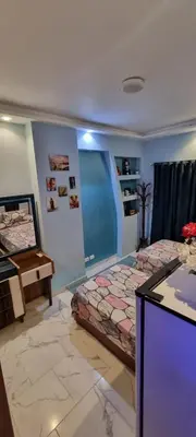 a bedroom with two beds and a desk in it at Turtles Beach Resort- Hurghada in Hurghada