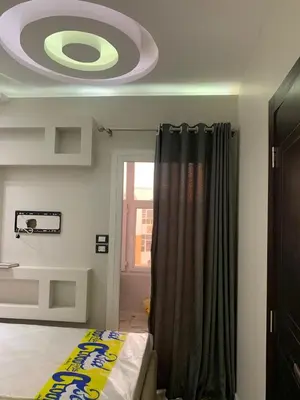 a room with a bed and a ceiling with a ceiling fan at 2 Bedroom in Andreas Residence in Hurghada