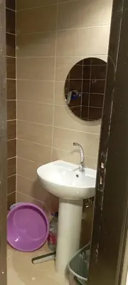 a bathroom with a sink and a mirror at Compound floranza in Hurghada