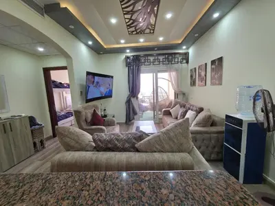 a large living room with couches and a tv at Sea view Luxury apartment at Al Andalous Sahl Hasheesh in Hurghada