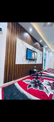 a bedroom with a large bed with a tv on the wall at Apartment in hurghada at hadba St in Hurghada