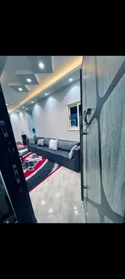 a room with a row of couches in a room at Apartment in hurghada at hadba St in Hurghada