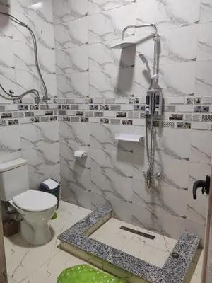 a bathroom with a toilet and a sink at Nature House in Luxor