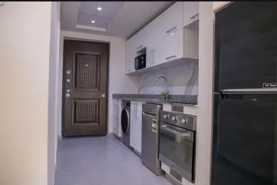 a kitchen with a sink and a dishwasher at Hurghada Scandic in Hurghada