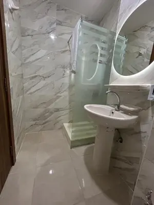 a bathroom with a sink and a mirror at Hurghada Holiday Studio with Beach in Hurghada