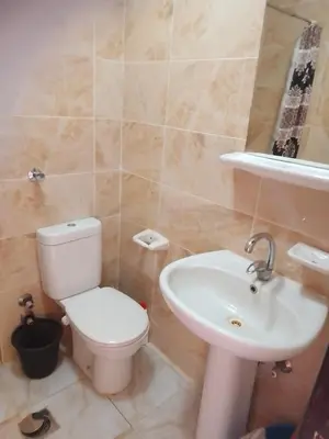 a bathroom with a toilet and a sink at Studio on the roof in Hurghada