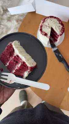 a piece of red velvet cake on a plate with a fork at Angel in Hurghada