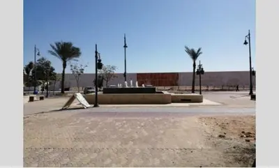 a park with a skate park with palm trees and a fountain at princess resort ,arch angilos Hurghada in Hurghada