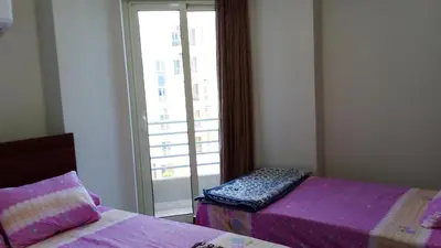 a bedroom with two beds and a window with a view at princess resort ,arch angilos Hurghada in Hurghada