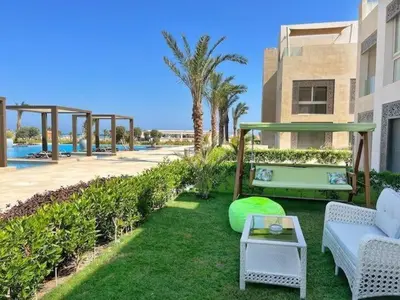 a patio with a couch and a table at Luxury 5 Bedrooms Sea Front Villa in Hurghada