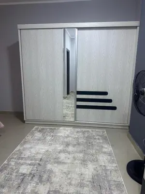 a room with a mirror and a closet at Inter Prime apartment 1 in Hurghada