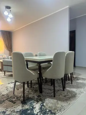 a dining room with a table and chairs at Inter Prime apartment 1 in Hurghada