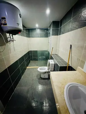 a bathroom with a toilet and a sink at 005 flamingo building Cozy appartement-two beds-1st floor with elevator in Hurghada