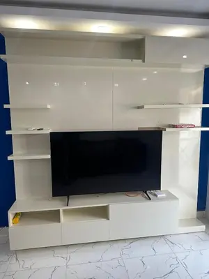 a white entertainment center with a flat screen tv at 005 flamingo building Cozy appartement-two beds-1st floor with elevator in Hurghada