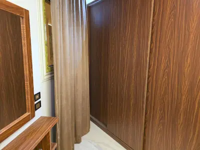 a room with a wooden door and a curtain at Dive Hostel Hurghada Sea Light in Hurghada