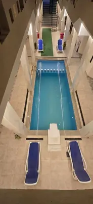 an overhead view of a swimming pool in a building at Dive Hostel Hurghada Sea Light in Hurghada