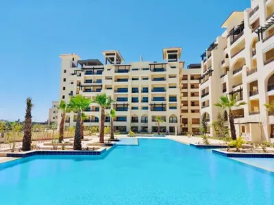 a large swimming pool in front of a building at Modern apartment in Hurghada al dau heights 3314 in Hurghada