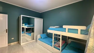a room with two bunk beds and a mirror at Apartment for rent 2 bed rooms in Hurghada