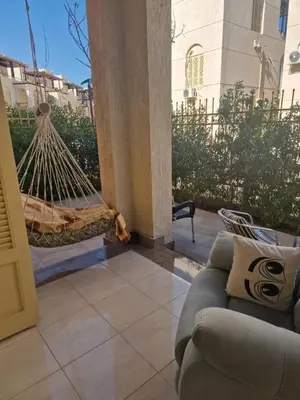 a living room with a couch and a hammock at Apartment for rent 2 bed rooms in Hurghada