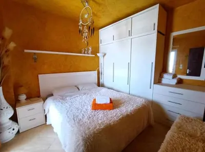 a bedroom with a white bed and a mirror at Davinci Beach Hotel Hurghada in Hurghada