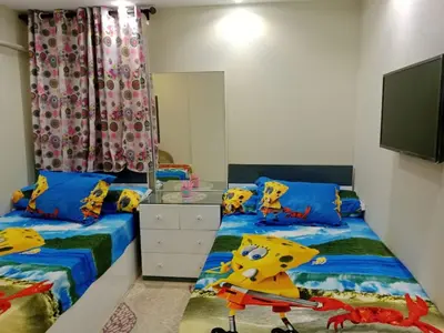 a bedroom with two twin beds and a tv at Selena Bay Resort in Hurghada