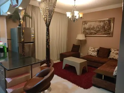 a living room with a couch and a table at Apartment for rent in Hurghada