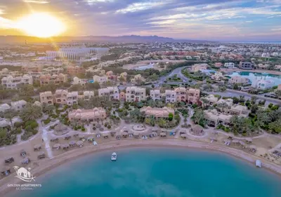 an aerial view of a resort with a pool at Dreamy 1BR in Italian Compound, Nubia, El Gouna in Hurghada