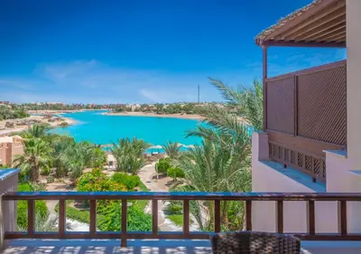 a view of a pool from a balcony at Dreamy 1BR in Italian Compound, Nubia, El Gouna in Hurghada