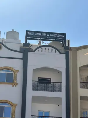 a building with a balcony on top of it at Palace view in Hurghada