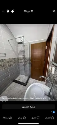 a bathroom with a shower and a white tub at Palace view in Hurghada