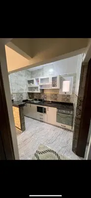 a kitchen with stainless steel appliances and a counter top at Palace view in Hurghada