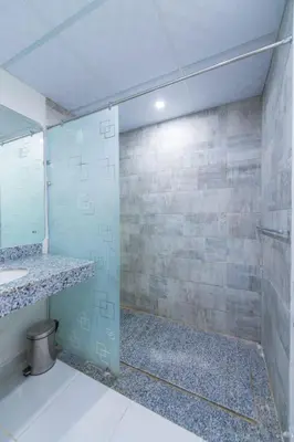 a bathroom with a shower and a sink at Scandic Resort Hurghada مبني سكندك رزوت الغردقة in Hurghada