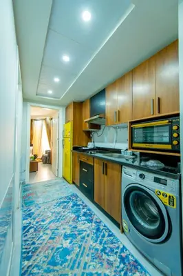 a kitchen with a washer and a washing machine at Scandic Resort Hurghada مبني سكندك رزوت الغردقة in Hurghada