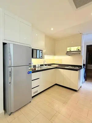 a kitchen with a refrigerator and a sink at Luxury hotel apartment 2rooms with triple sea view in Hurghada