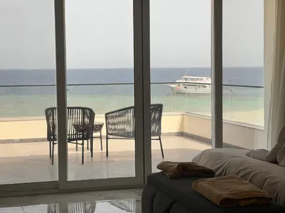 a living room with a view of the ocean at Villa KUBA luxury in Hurghada