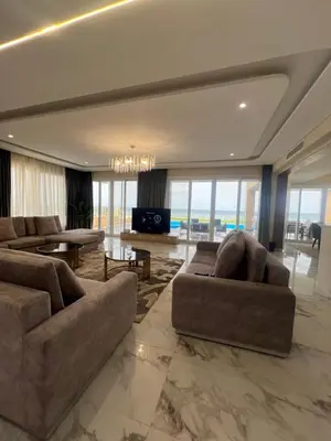 a living room with two couches and a table at Villa KUBA luxury in Hurghada