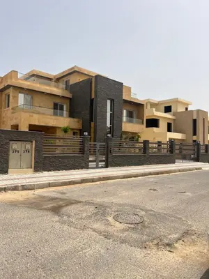 a couple of buildings on the side of a street at Villa KUBA luxury in Hurghada