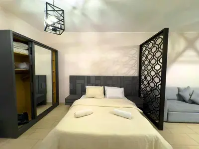 a bedroom with a large bed with two white pillows at Golden Aldau Heights studio Hurghada 1019 in Hurghada