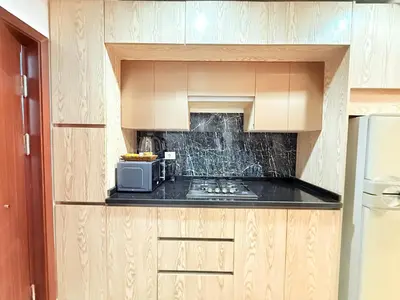 a small kitchen with a microwave and a counter at Studio in Dow Heights Compound in Hurghada