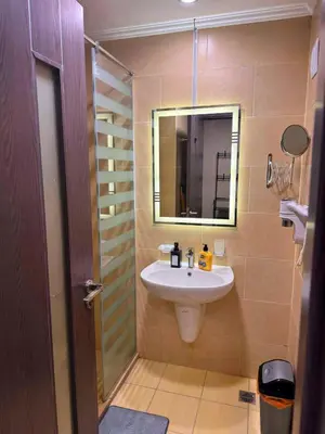 a bathroom with a sink and a mirror at the flower of the sea in Hurghada