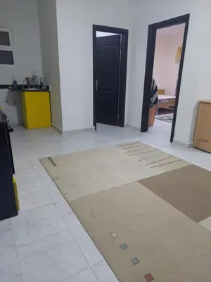 a room with two black doors and a tile floor at Hurghada in Hurghada