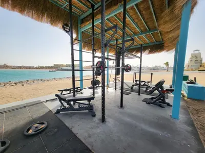 a gym on the beach with tread machines at Mangroovy- 1br GF Waterfront Glitzy direct pool in Hurghada