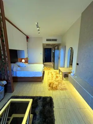 a large bedroom with a bed and a mirror at More Relaxation Aldau Heights Studio in Hurghada in Hurghada