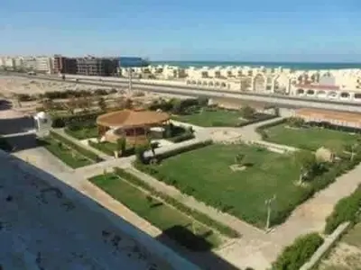 arial view of a city with buildings and a highway at كمبوند سكاي 2 in Hurghada